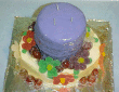 Another candle cake with jelly candy flowers around the base